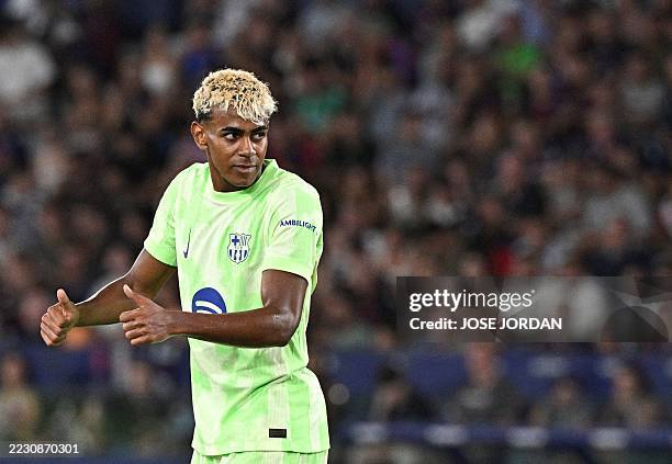 Barcelona's Spanish forward Lamine Yamal gestures during the Spanish league football match between Levante UD and FC Barcelona at Ciutat de Valencia...