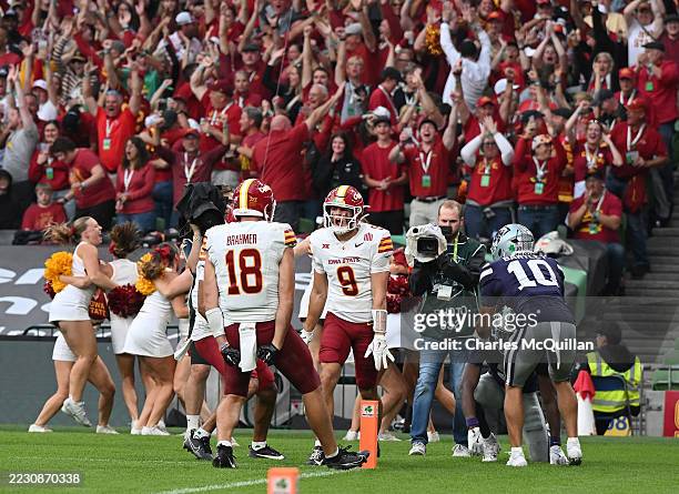 Brett Eskildsen celebrates of the Iowa State Cyclones celebrates with team mates after scoring a touchdown against the Kansas State Wildcats during...