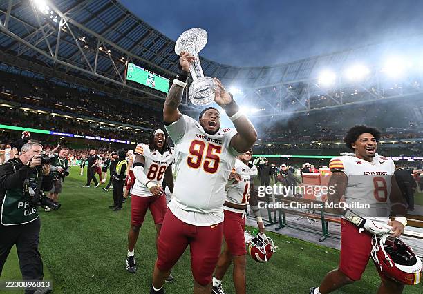 Iowa State player Domonique Orange celebrates with the trophy following the Aer Lingus Classic College Football game between Kansas State Wildcats...
