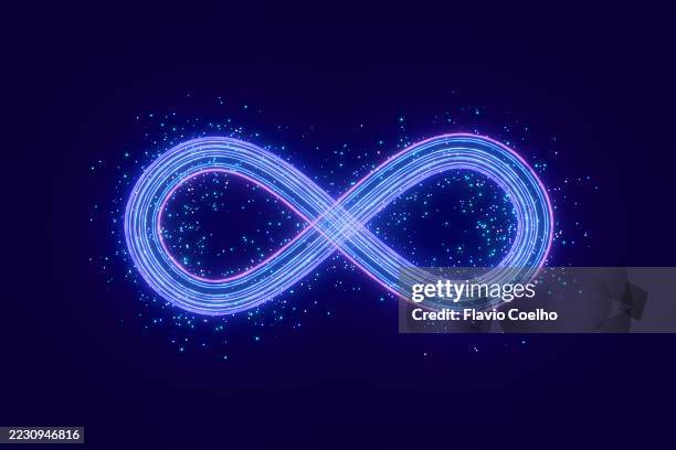a luminous, high-speed infinity symbol suggests perpetual motion and limitless possibilities - movimiento perpetuo fotografías e imágenes de stock
