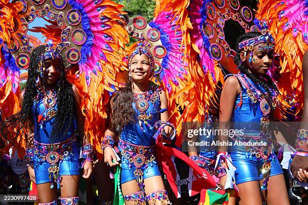 Revellers attend Notting Hill Carnival on August 24, 2025 in London, England. The Notting Hill carnival was established in 1959 to foster community...
