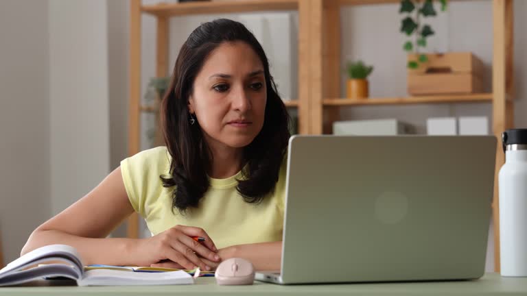 https://media.gettyimages.com/id/2231126692/video/woman-studying-and-taking-notes-at-home-using-laptop.jpg?b=1&s=640x640&k=20&c=AoGcJ_3nFOyOjo8ryxIcgsE3SzKfCJOX6dGGQrDsSiE=