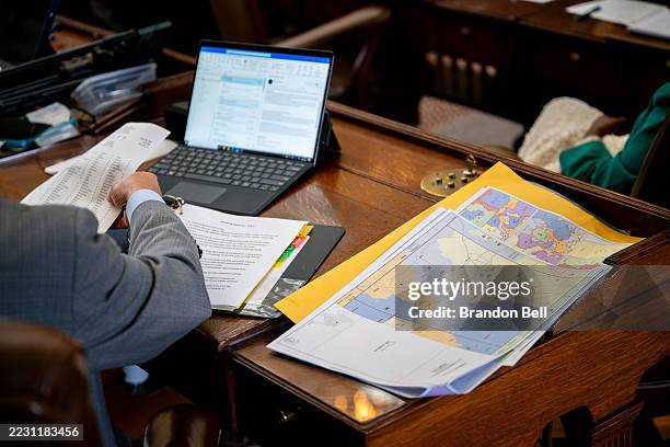 Maps are displayed on Texas Democratic Rep. Chris Turner's desk during a House meeting in the State Capitol on August 20, 2025 in Austin, Texas....