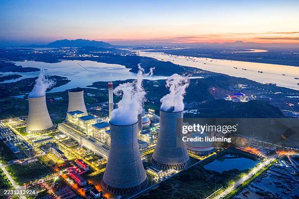 night view of cooling tower of thermal power plant - kerncentrale stockfoto's en -beelden