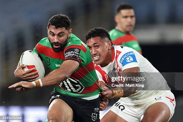 Alex Johnston of the Rabbitohs is tackled during the round 25 NRL match between South Sydney Rabbitohs and Dolphins at Accor Stadium, on August 21 in...