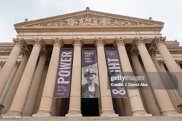 Banners highlighting a current exhibit hang between the columns of the Archives of the United States building on the National Mall on August 20 in...