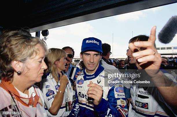 Damon Hill makes his way into the garage at the British GP, Silverstone Circuit, United Kingdom, 12th-14th July 1996.