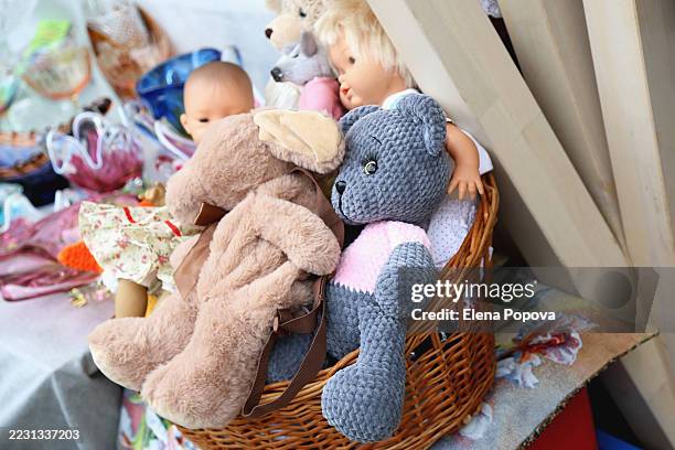 street flea market with second hands toys, teddy bears and dolls - doll stock pictures, royalty-free photos & images