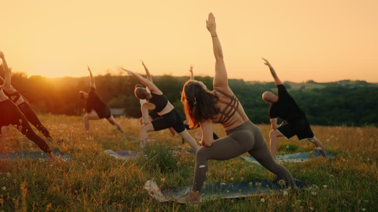 https://media.gettyimages.com/id/2231383960/video/instructor-with-class-practicing-three-legged-downward-dog-yoga-pose-outdoors-on-grassy-field.jpg?b=1&s=640x640&k=20&c=QnZTdnOEd7VZP44gb7HLA0SuOqMrqgdbuhg8OtNSMOM=