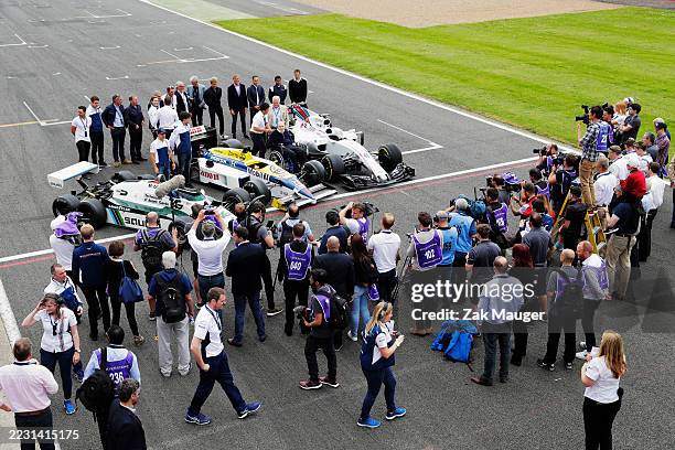 Williams 40 Event Silverstone, Northants, UK Friday 2 June 2017. Sir Frank Williams and Patrick Head pose for media between a Williams FW40 Mercedes,...