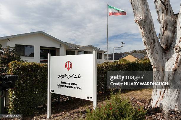 The Iranian national flag flies over the Iranian embassy in Canberra on August 26, 2025. Australia's government said on August 26, it is expelling...