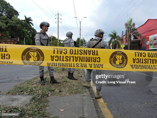 Airforce soldiers stand behind a do not cross tape after men allegedly thew cylinders loaded with explosives, leaving 6 dead and more than 60 wounded...