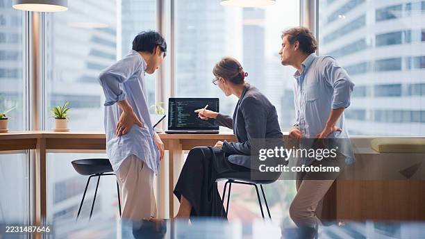 startup team having a brainstorming session on coding strategies. - inteligencia artificial imagens e fotografias de stock