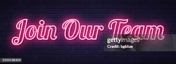 join our team - glowing neon text on brick wall background - help wanted stock illustrations
