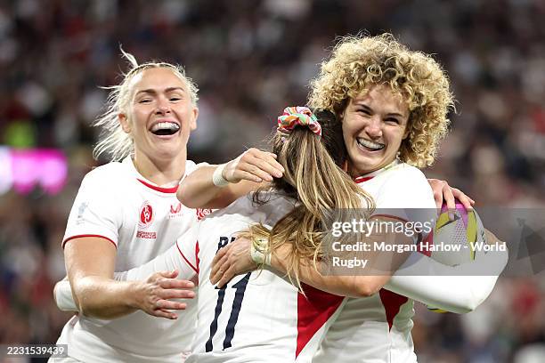 Jess Breach of England celebrates with teammate Ellie Kildunne after scoring her team's tenth try during the Women's Rugby World Cup 2025 Pool A...