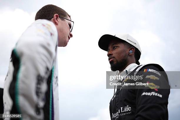Rajah Caruth, driver of the Atlanta Life Insurance Chevrolet, talks with Daniel Dye, driver of the Martech Services Company Chevrolet, during...