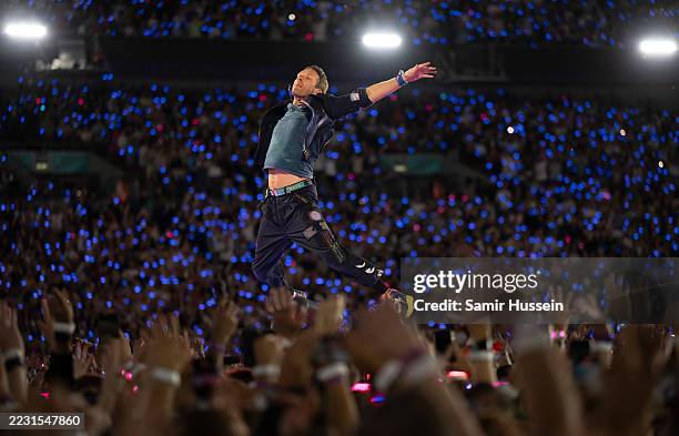 Chris Martin of Coldplay performs onstage during a concert at Wembley Stadium on August 22, 2025 in London, England.