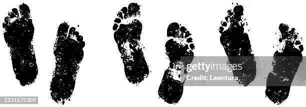 footprints - footprints in sand stock illustrations