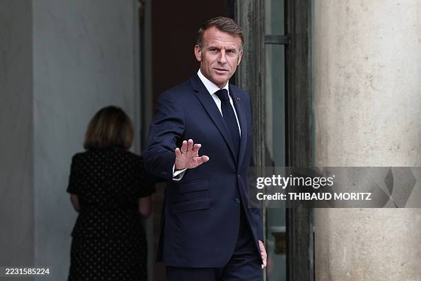 France's President Emmanuel Macron waves as he arrives to welcome Senegalese President for a meeting at the Elysee Presidential Palace in Paris on...