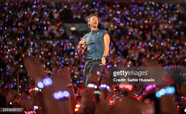 Chris Martin of Coldplay performs onstage during a concert at Wembley Stadium on August 22, 2025 in London, England.