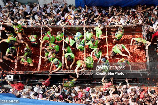 People covered in tomato pulp take part in the 78th 'Tomatina' Festival in Bunol, Spain, on August 27, 2025. They throw a total of 120 tonnes of...