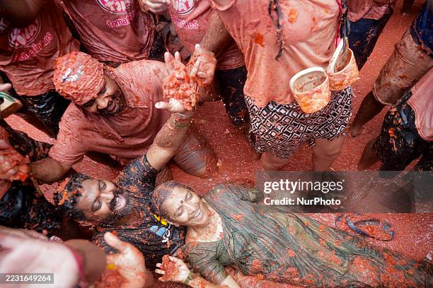 People covered in tomato pulp take part in the 78th 'Tomatina' Festival in Bunol, Spain, on August 27, 2025. They throw a total of 120 tonnes of...