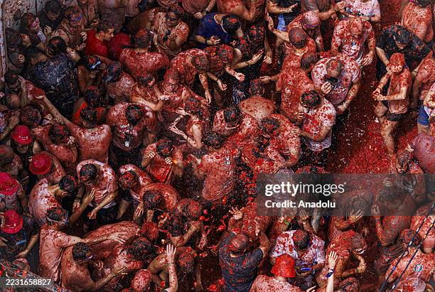 Participants take part in the 78th annual "La Tomatina" Festival in Bunol, Valencia, Spain on August 27, 2025. Participants throw 120 tons of...