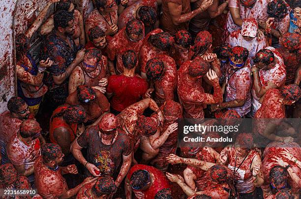 Participants take part in the 78th annual "La Tomatina" Festival in Bunol, Valencia, Spain on August 27, 2025. Participants throw 120 tons of...