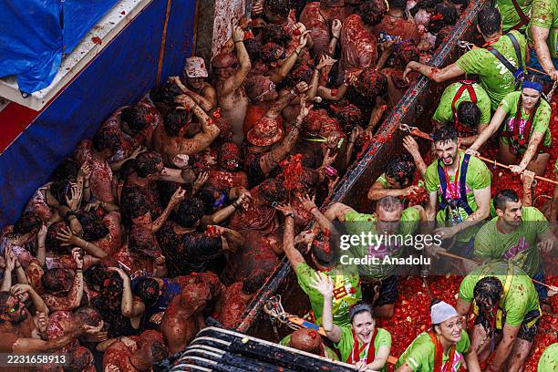 Participants take part in the 78th annual "La Tomatina" Festival in Bunol, Valencia, Spain on August 27, 2025. Participants throw 120 tons of...