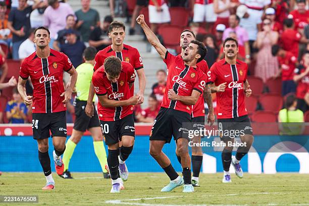 Mateu Morey of RCD Mallorca celebrates scoring his team´s first goal with teammates during the LaLiga EA Sports match between RCD Mallorca and RC...