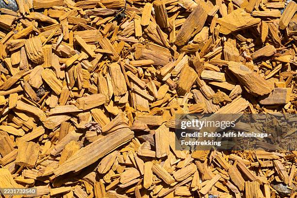 dyed woodchips creating a vibrant textured surface - biodegradable stock pictures, royalty-free photos & images