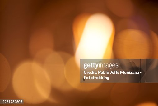 Blurred golden lights creating a warm festive atmosphere Blurred golden lights creating a warm festive atmosphere
