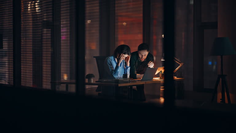 https://media.gettyimages.com/id/2231739033/video/overloaded-partners-brainstorming-night-office-looking-laptop-two-colleagues.jpg?b=1&s=640x640&k=20&c=MA2qT624AioXBWRSl_9ksH2RYVuRLmY3GACIM4zdB5E=