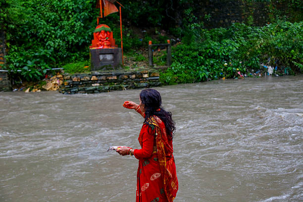 Hindu women perform rituals at the bank of the Bagmati River during Rishi Panchami in Kathmandu, Nepal, on August 28, 2025.