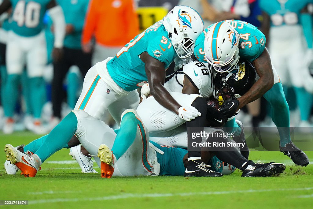 Jordan Colbert Jordan Colbert of the Miami Dolphins tackles Darius Lassiter of the ...