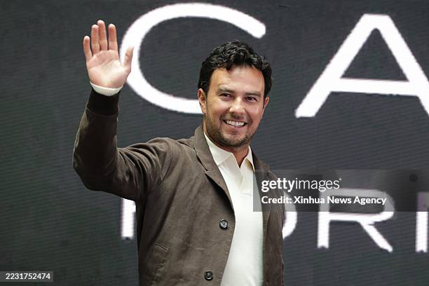 Mexican Formula One driver Sergio Perez gestures during a press conference about his return to Formula One in 2026 as part of the Cadillac team, in...