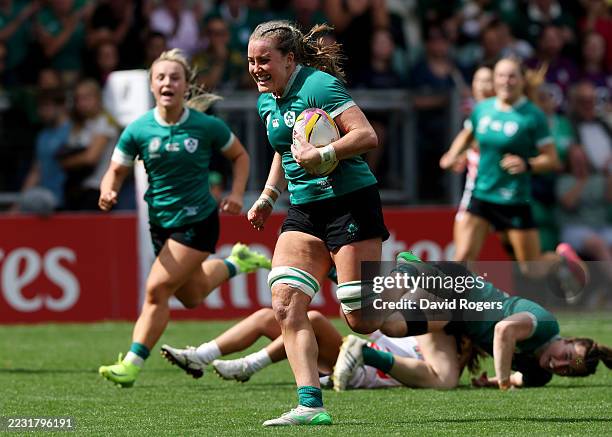 Fiona Tuite of Ireland runs with the ball before scoring her team's fourth try during the Women's Rugby World Cup 2025 Pool C match between Ireland...