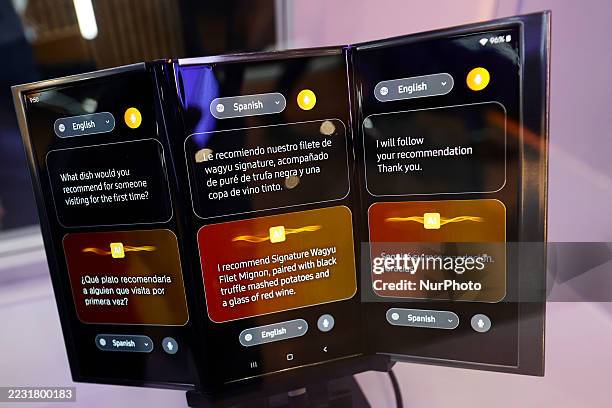 In Barcelona, Spain, on March 5 a Samsung triple-fold horizontal AMOLED device unfolds on a table, displaying a restaurant menu. It highlights...
