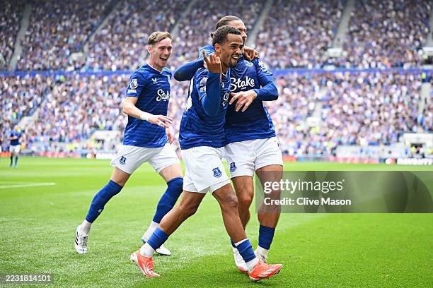 Iliman Ndiaye of Everton celebrates scoring his team's first goal with teammate Jack Grealish during the Premier League match between Everton and...
