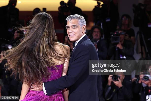 Amal Clooney and George Clooney during the "Jay Kelly" red carpet during the 82nd Venice International Film Festival on August 28, 2025 in Venice,...