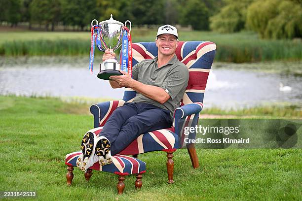 Alex Noren of Sweden poses with the Betfred British Masters trophy following victory on day four of the Betfred British Masters hosted by Sir Nick...
