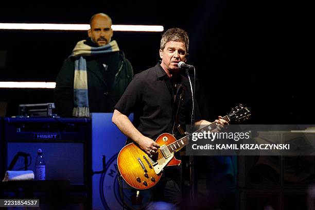 Lead guitarist and co-lead vocalist of British rock band Oasis Noel Gallagher performs on stage at Soldier Field in Chicago on August 28 during the...