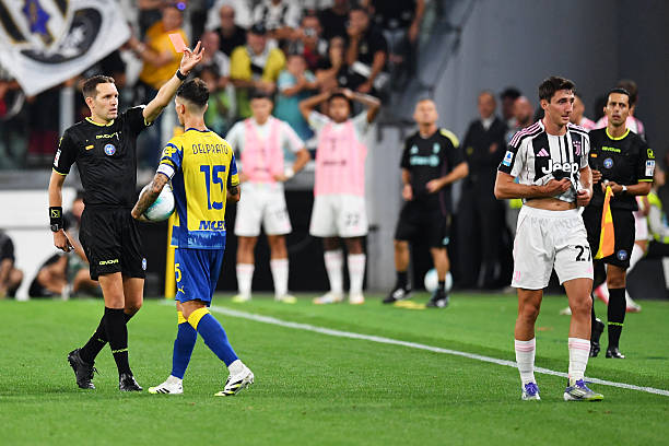 Andrea Cambiaso of Juventus is shown a red card by referee Matteo Marcenaro during the Serie A match between Juventus FC and Parma Calcio 1913 at on...