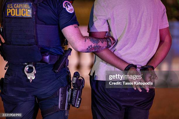 Captiol Police, Washington DC Metro Police and U.S. Boarder Patrol arrest one of two men who where allegedly fighting, with one allegedly possessing...