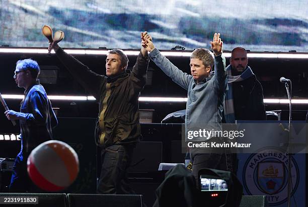 Liam Gallagher and Noel Gallagher perform onstage at the Oasis Live '25 - Toronto concert at Rogers Stadium on August 24, 2025 in Toronto, Ontario.