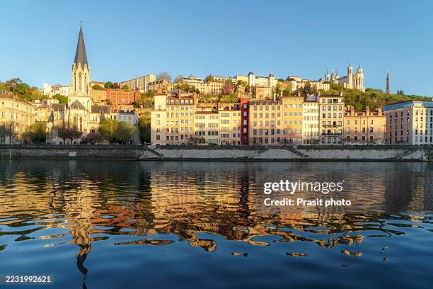 golden-hour reflections of lyon riverbank churches and façades - rhone stock pictures, royalty-free photos & images
