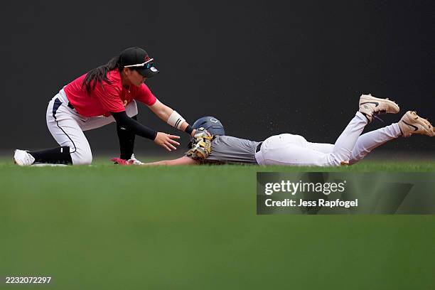 Park Jua tags out Kiley Ingram at second base in a scrimmage during tryouts for the Women’s Professional Baseball League at Nationals Park on August...