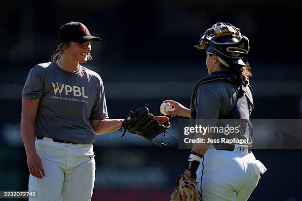 Jaida Lee gets the ball from Alexia Jorge while pitching in a scrimmage during tryouts for the Women’s Professional Baseball League at Nationals Park...