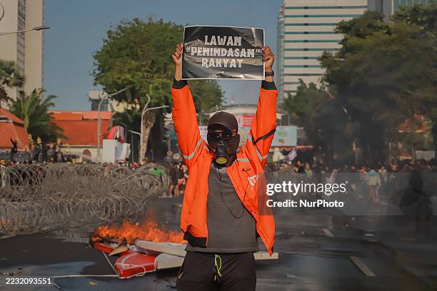 In Surabaya, Indonesia, on August 29 a demonstrator is pictured during a protest against the Mobile Brigade Corps or 'Brimob', following the death of...