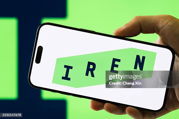 Iris Energy logo displayed on smartphone screen, News Photo